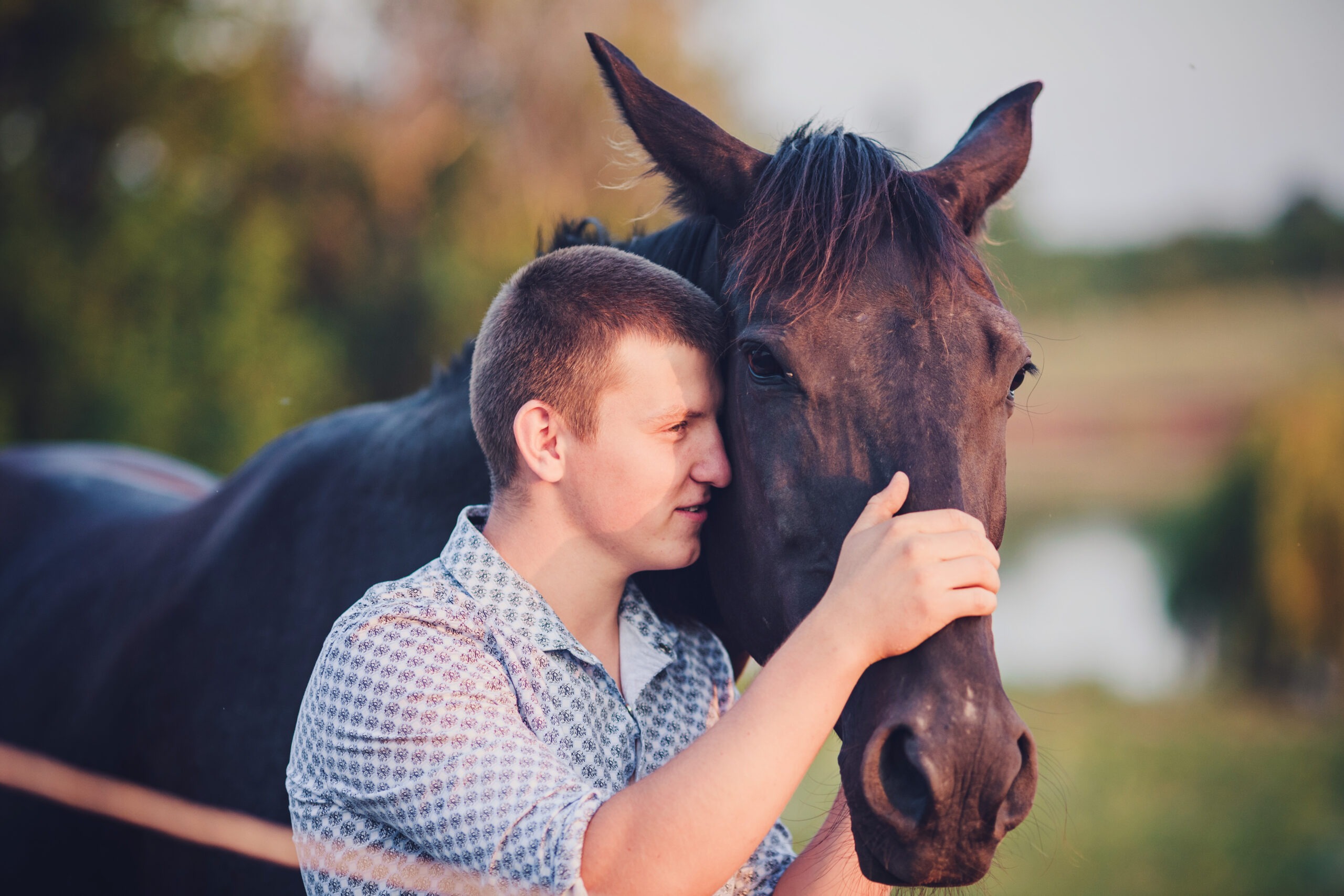 young man and a horse